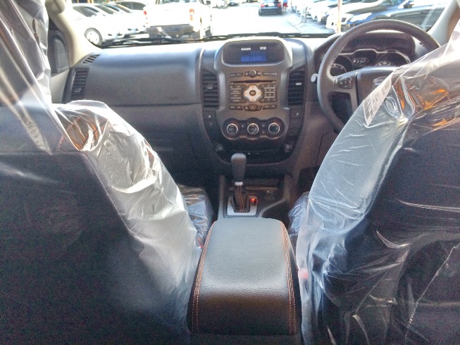 Orange Ford Ranger Wildtrak Interior Front driver and passenger cabin